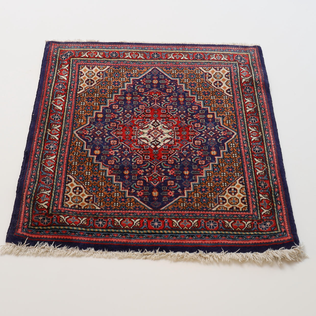 A HAND-KNIT RUG, oriental.