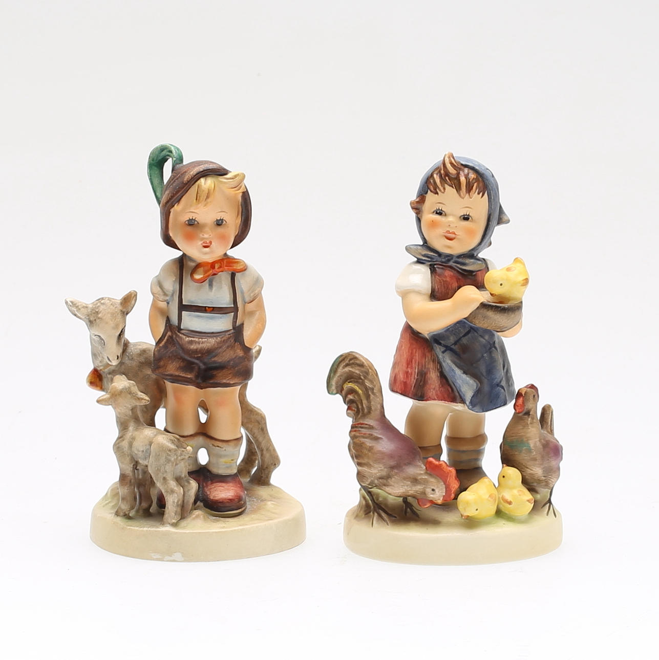 FIGURER, 2 st, porslin, M.J. Hummel, Goebel, 1900-talets andra hälft.