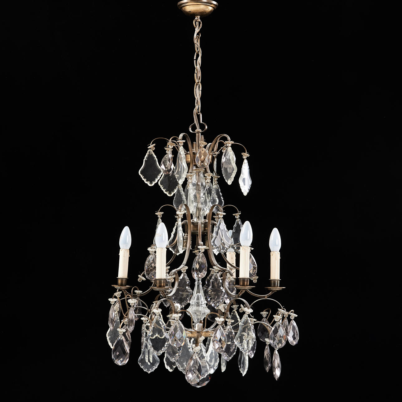 A rococo style chandelier, brass frame, framed with prisms. 6 points of ...