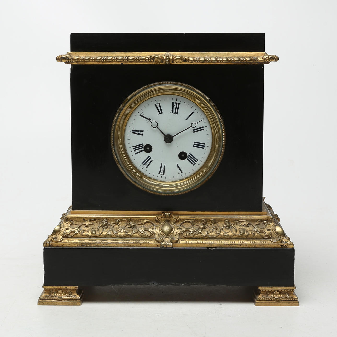 A stone/metal table clock, probably 19th century.