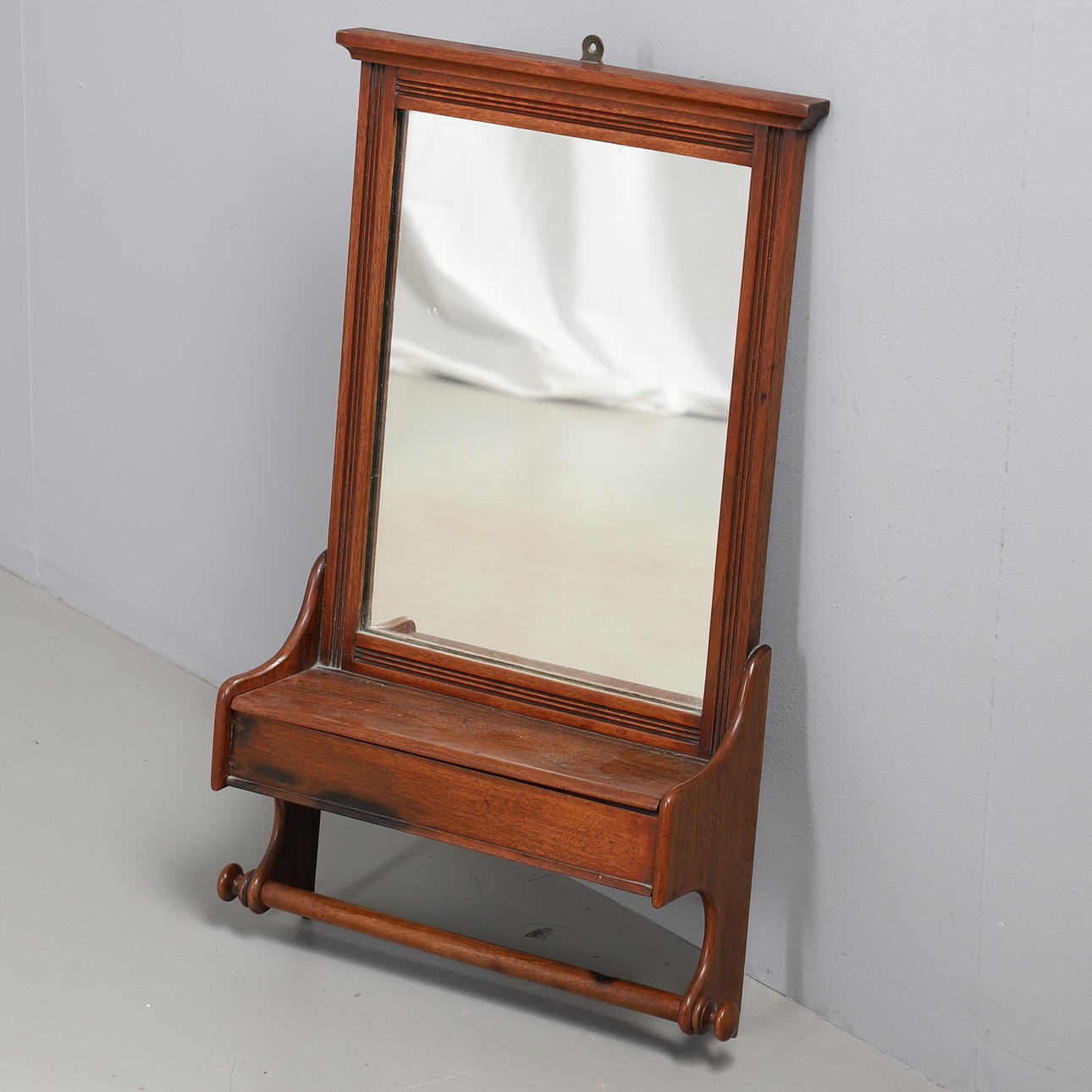 A WALNUT HALL MIRROR WITH GLOVE BOX.