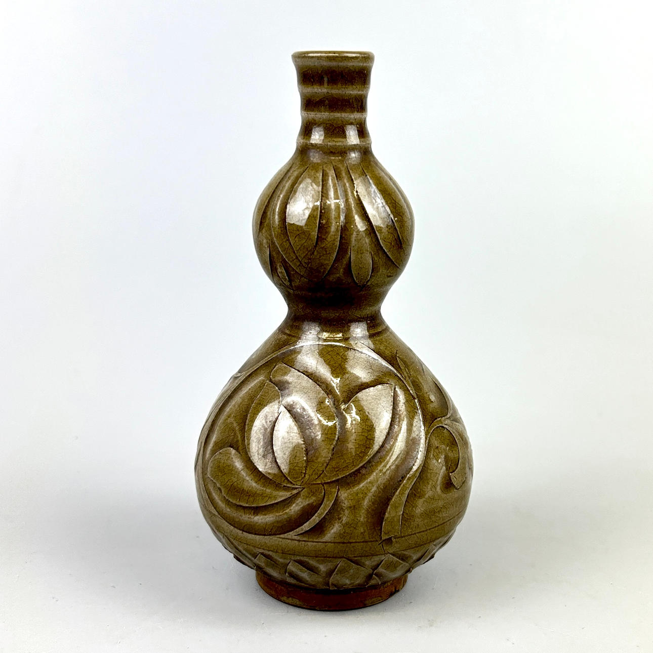 CHINESE GREEN GLAZED & SGRAFFITO GOURD VASE.