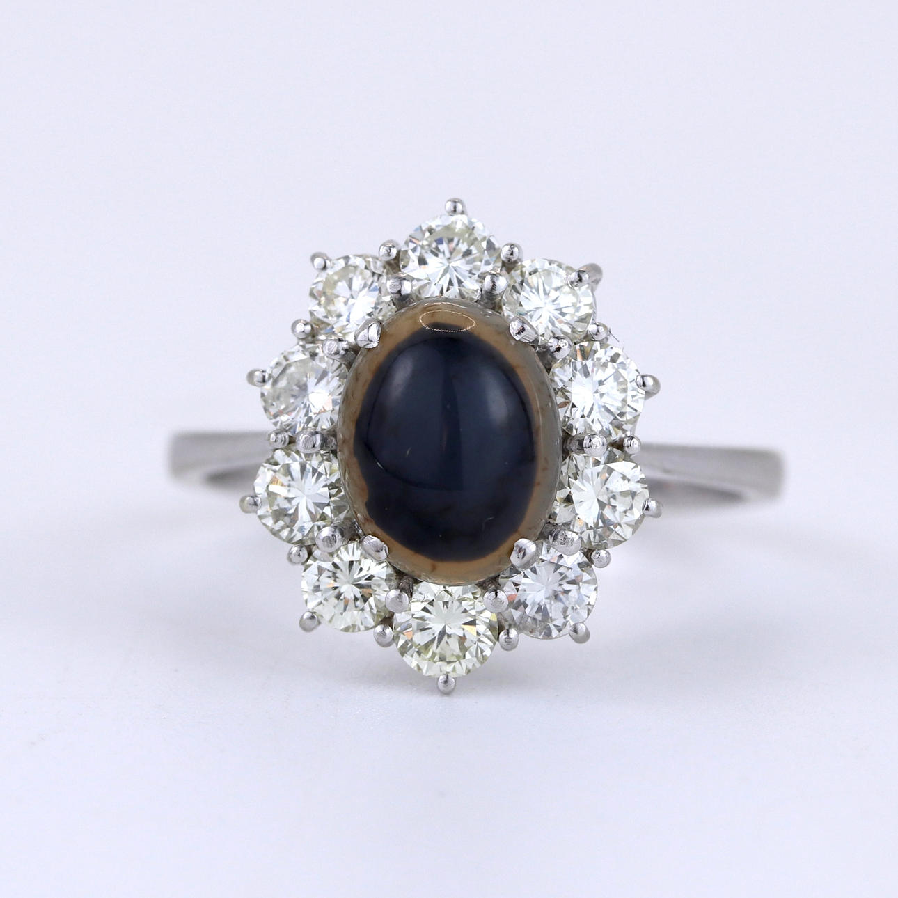 18CT WHITE GOLD CABOCHON SAPPHIRE AND DIAMOND RING.