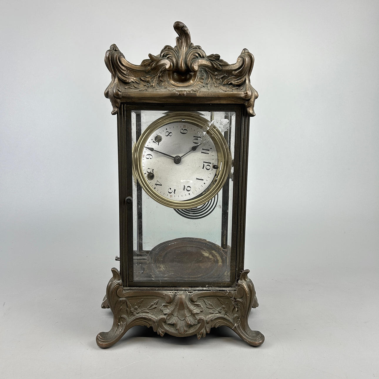 BRONZE FOUR GLASS CLOCK.