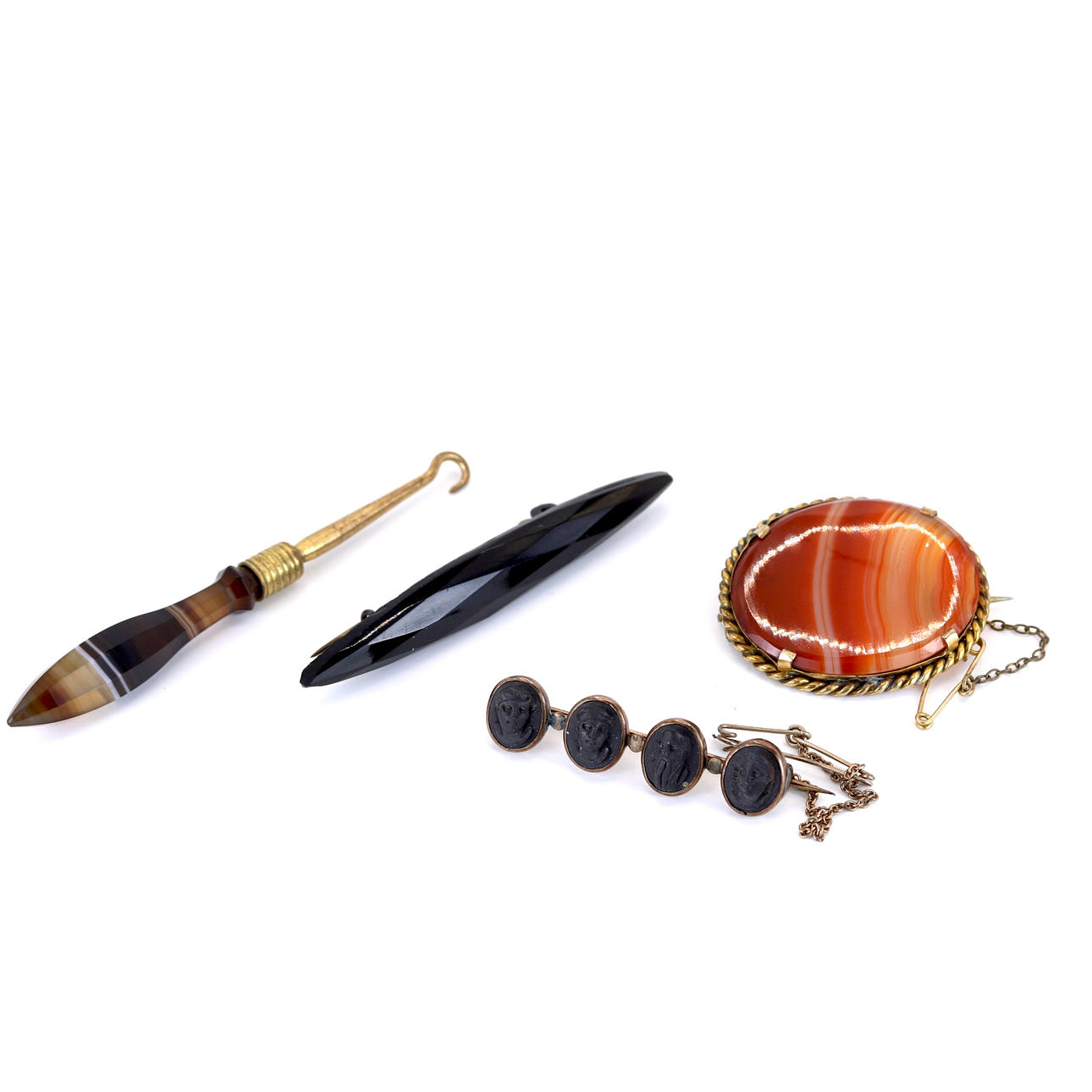 THREE ANTIQUE BROOCHES AND BUTTON HOOK.