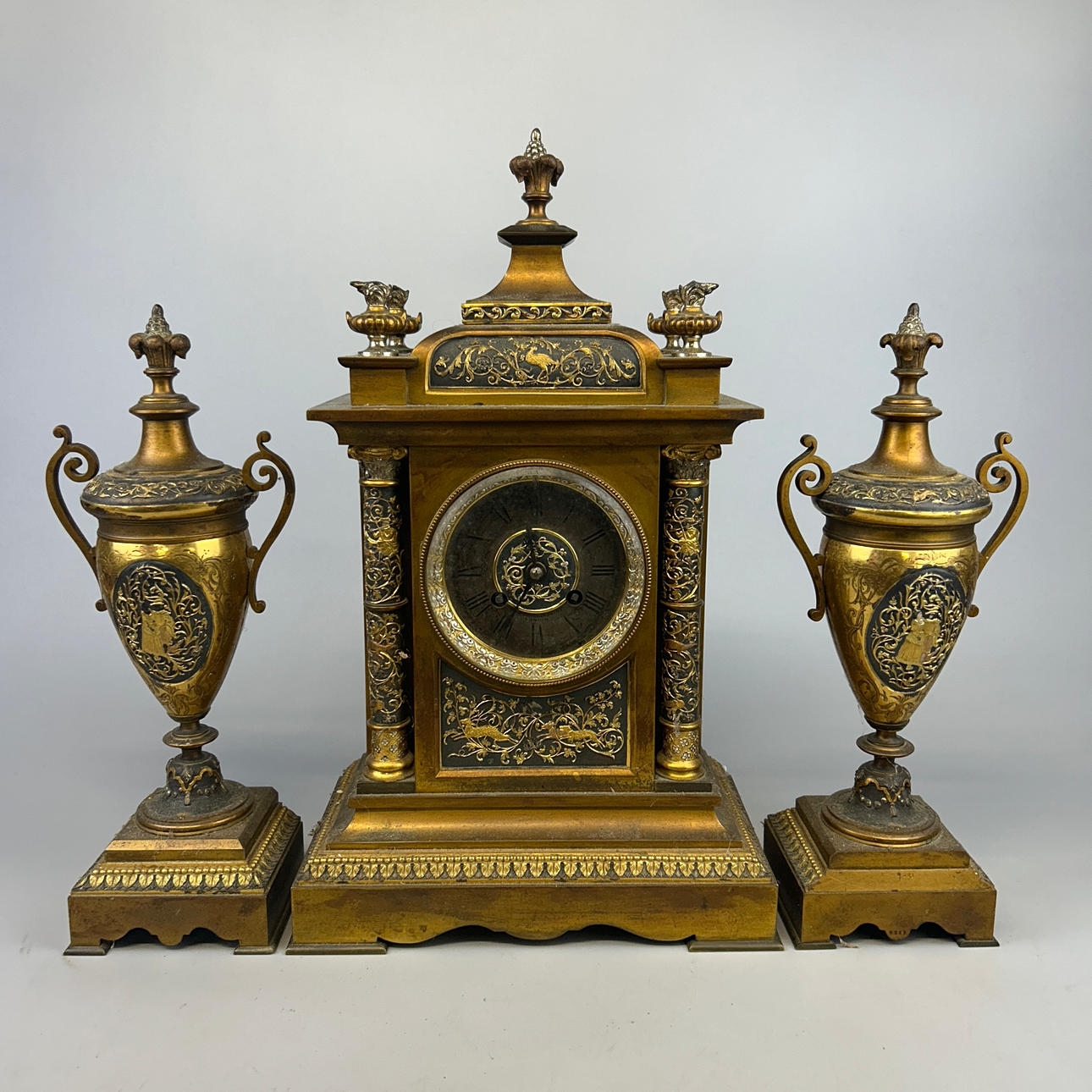 19thC THREE PIECE GILT BRONZE GARNITURE.