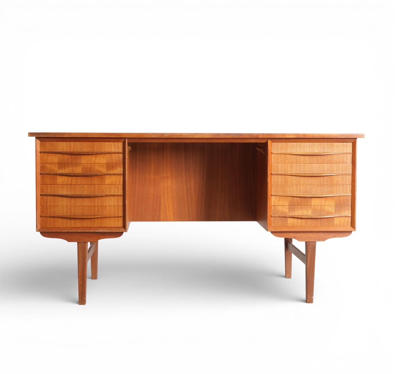 Teak desk with eight drawers with elegant handles.