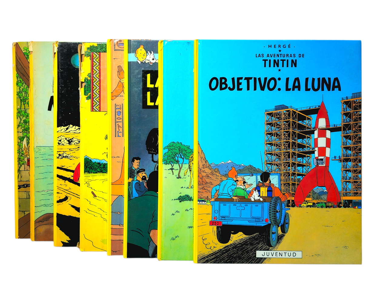 Tintin. Eight comics.