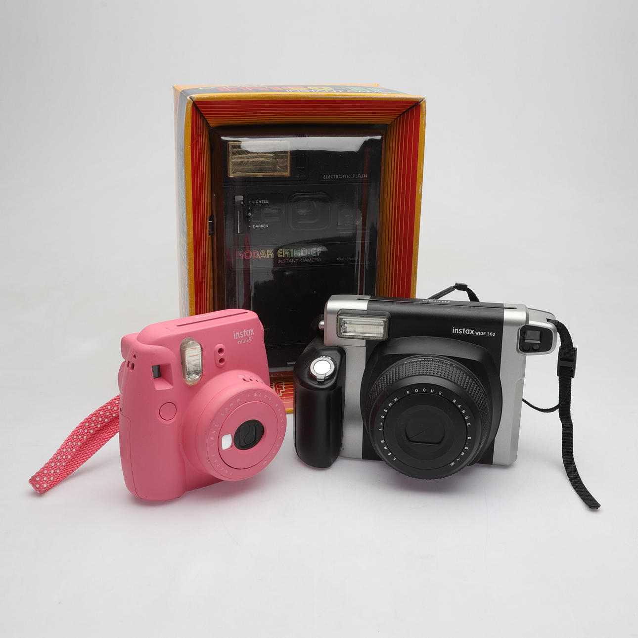 Three Kodak and Fujifilm Polaroid Cameras, 19th/2000s. Photo, Cameras ...