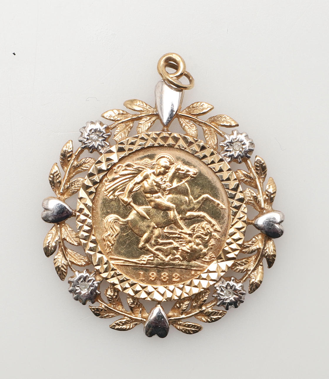 A GOLD HALF SOVEREIGN IN 9CT GOLD AND DIAMOND PENDANT MOUNT. Jewellery ...
