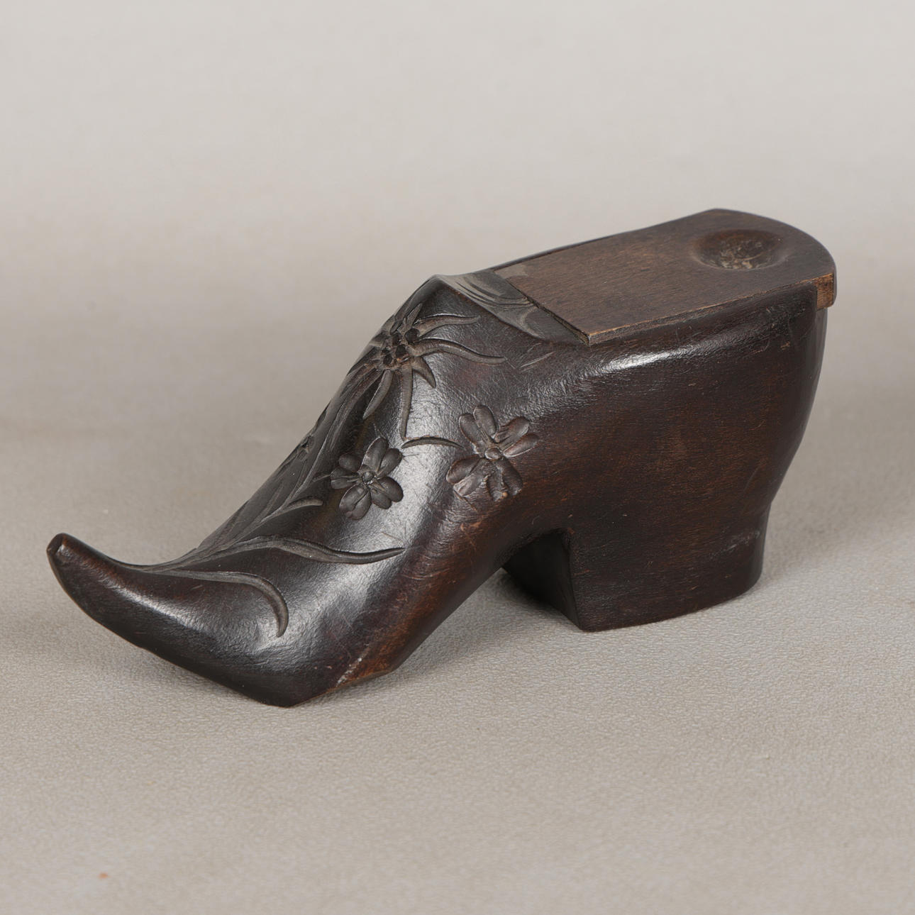 A BLACK FOREST SHOE INKWELL.