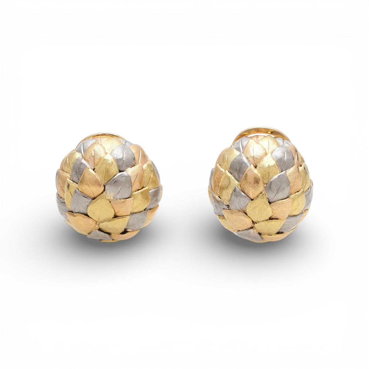 Three-colour gold button earrings, circa 1960.