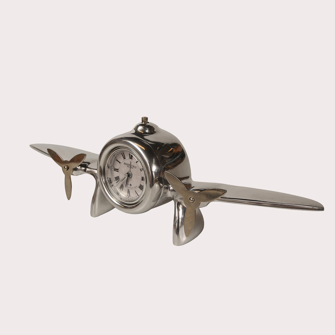 TABLE CLOCK, aluminum, in the shape of an airplane, marked Aeropostale ...