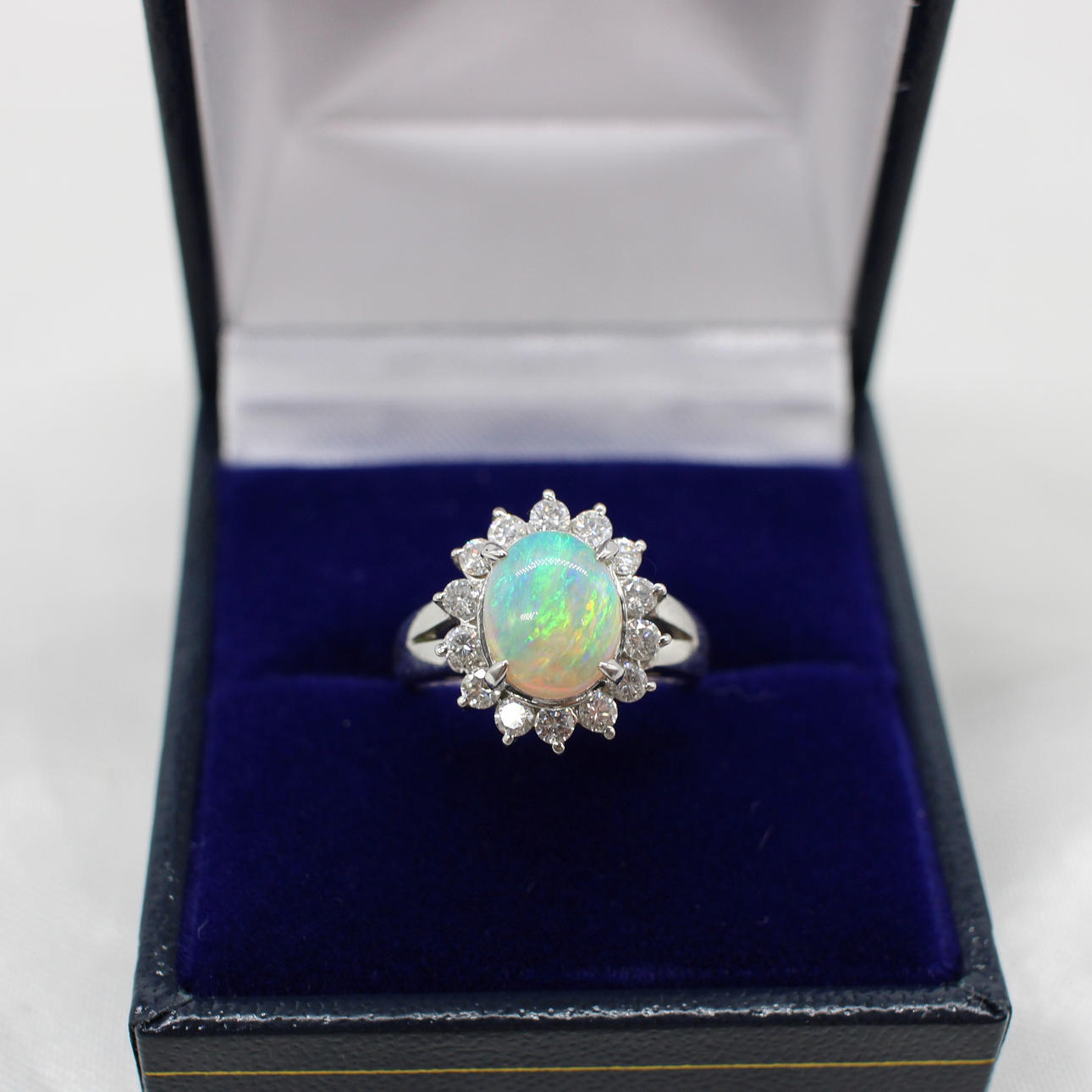 OPAL & DIAMOND CLUSTER RING IN PLATINUM.