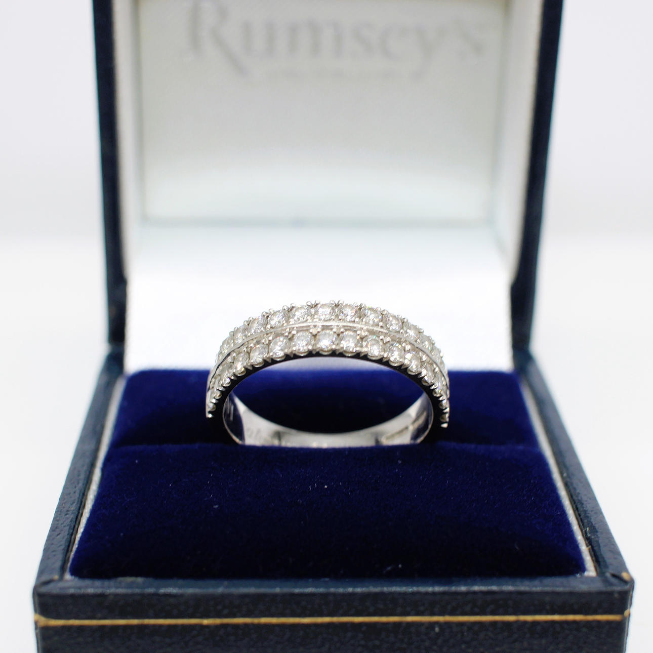0.65CT DIAMOND HALF ETERNITY RING.