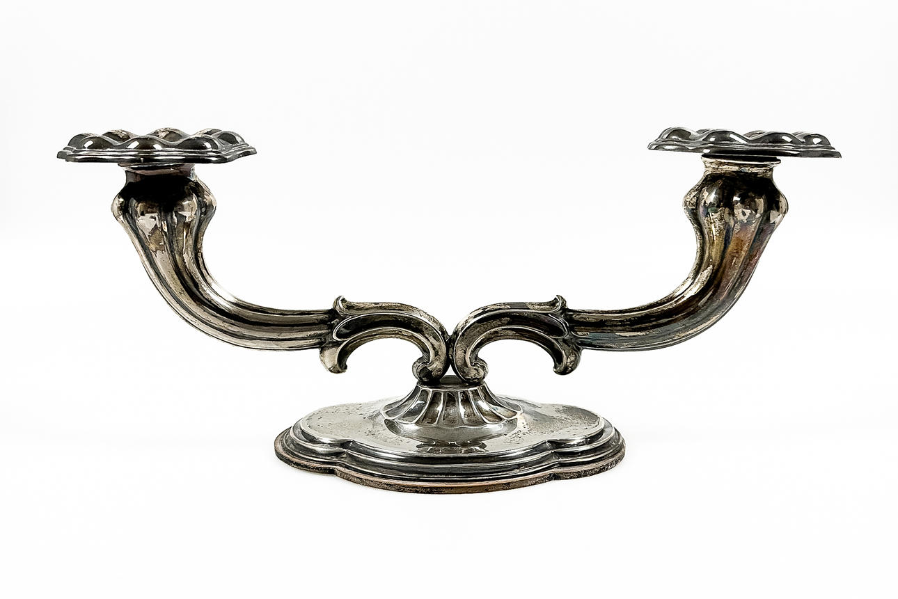C G HALLBERG. A 2-armed candlestick, silver, 1938.