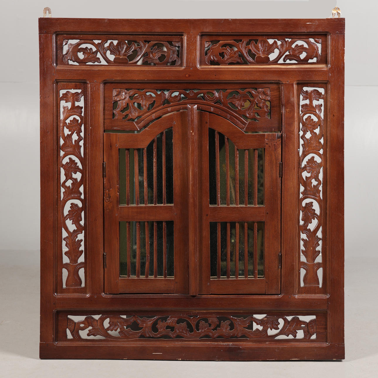 A CONTINENTAL WINDOW SHUTTER WALL MIRROR.