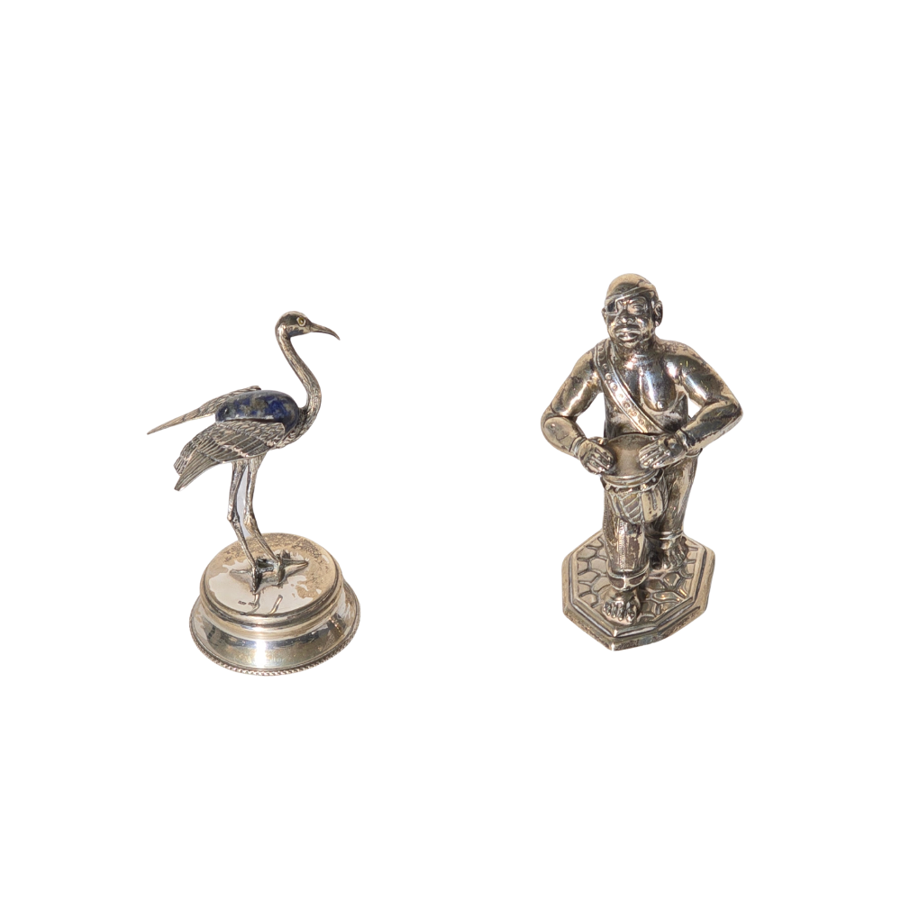 TWO FIGURES IN SILVER.