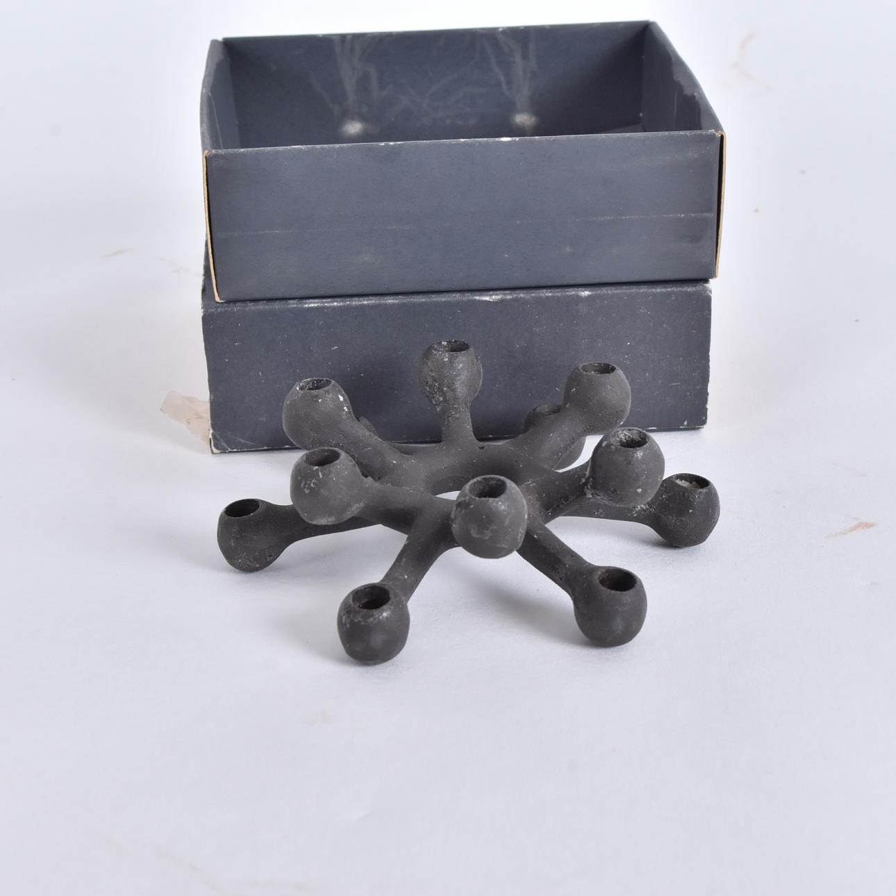 JENS  QUISTGAARD. Candlestick, cast iron, Danish Design Ltd.