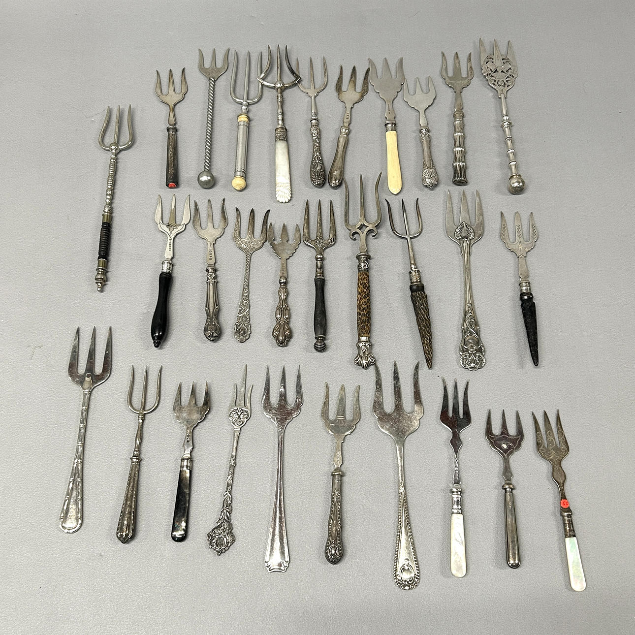 COLLECTION OF 19TH C SILVER PLATED BREAD FORKS.