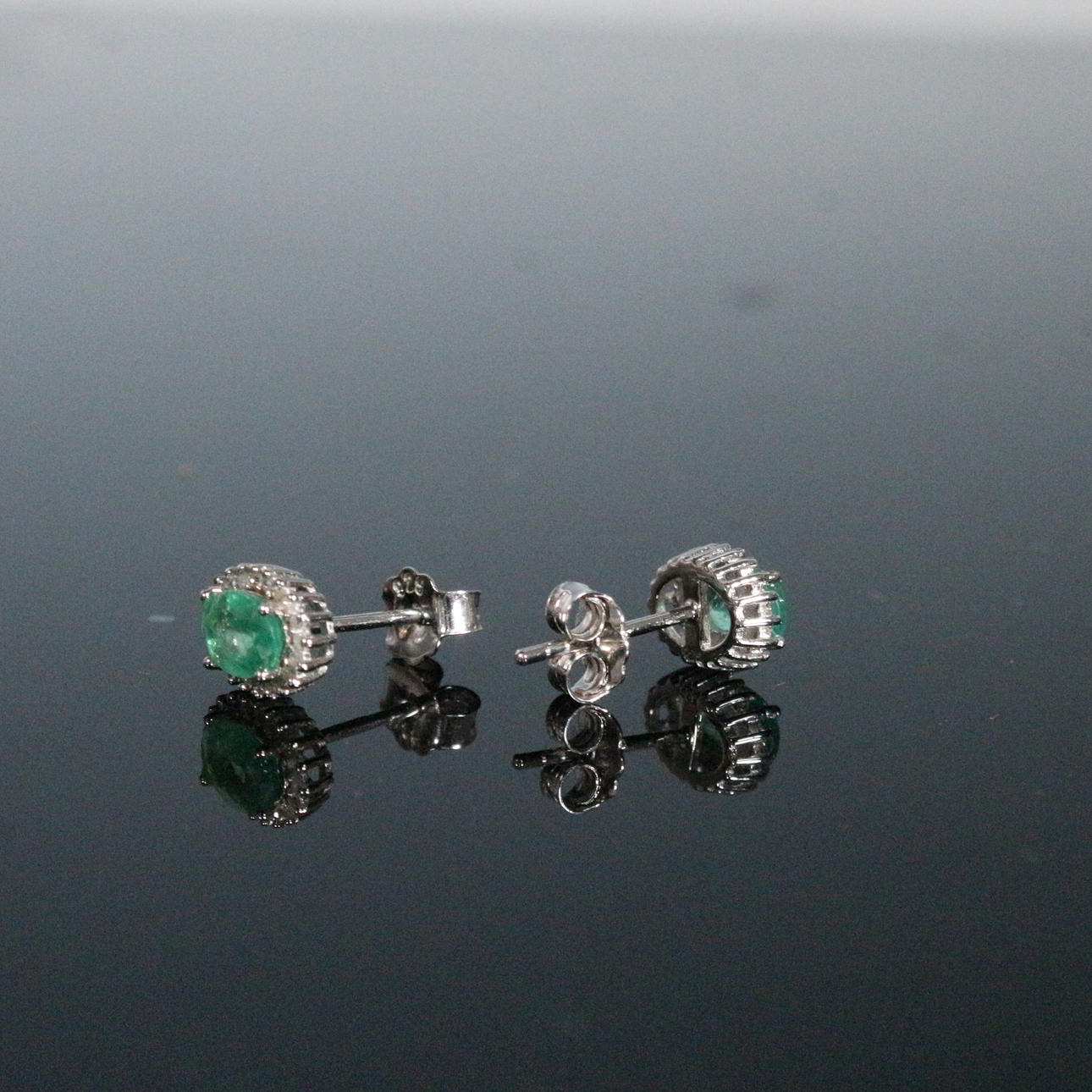 Emerald and diamond earrings.