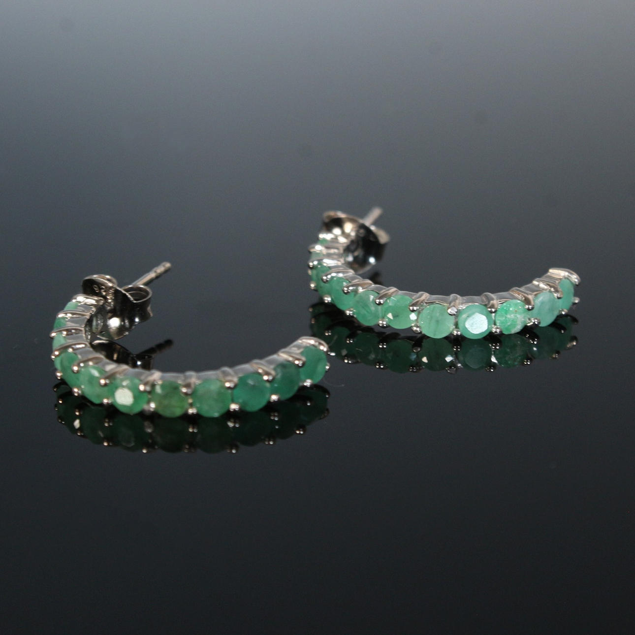 Emerald – half-hoop earrings.