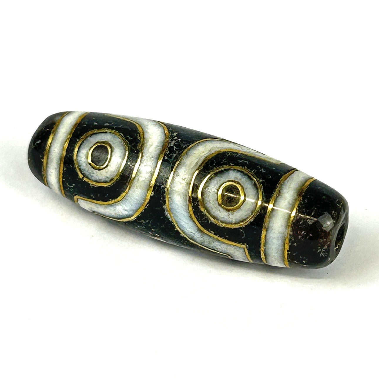 A GOLD INLAY AGATE DZI BEAD.
