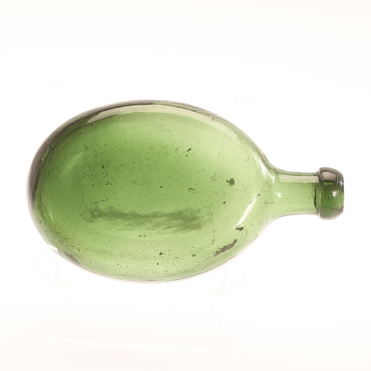 A bottle, green glass, 19th century.