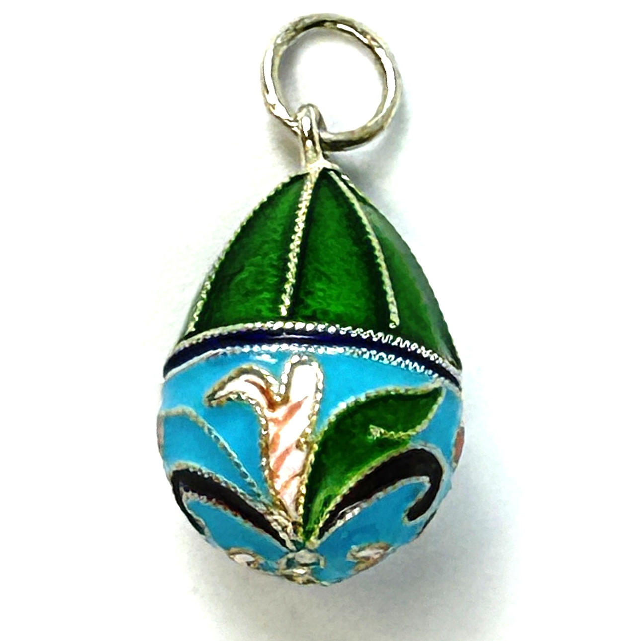 A SILVER EGG PENDANT.