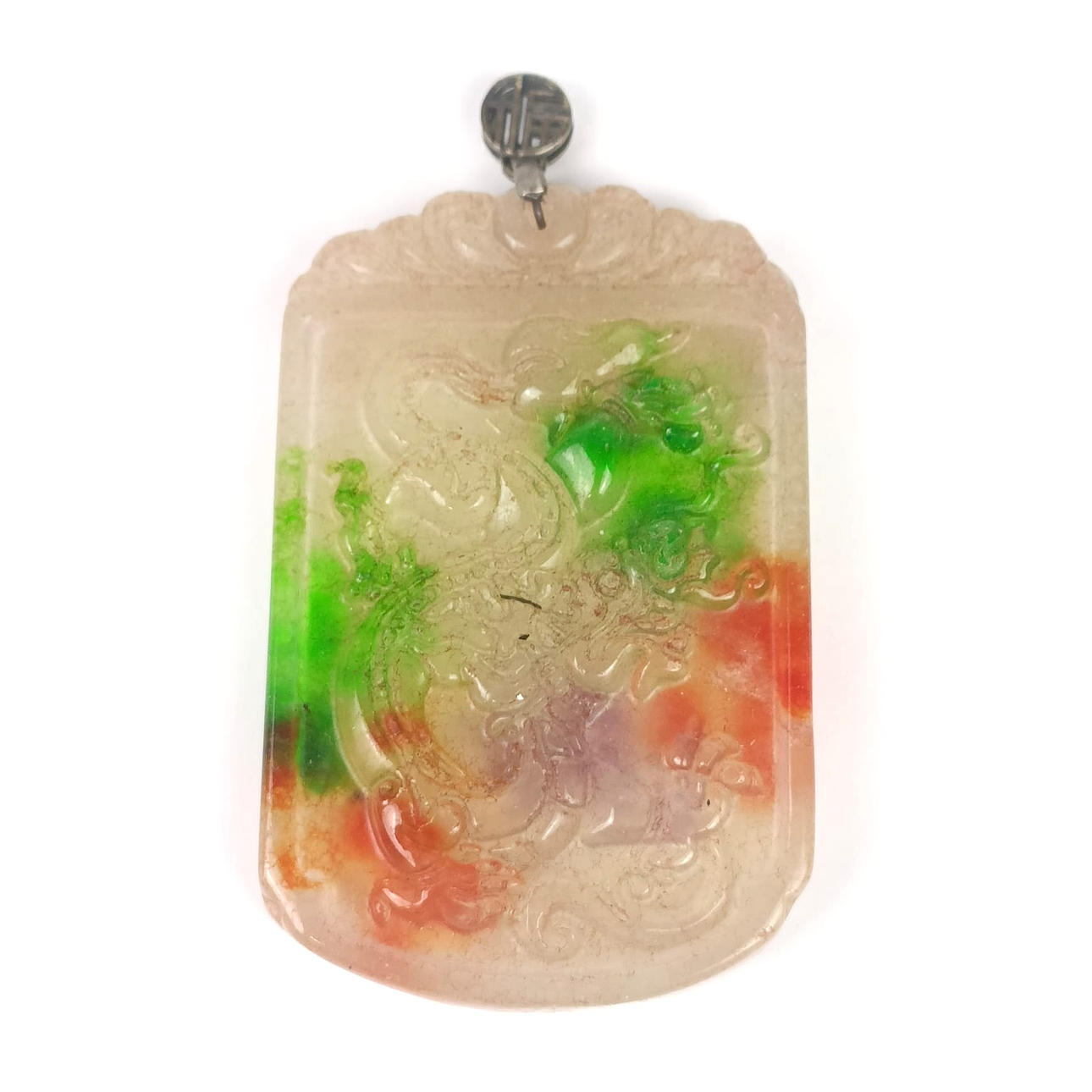 A CHINESE CARVED STONE PENDANT.