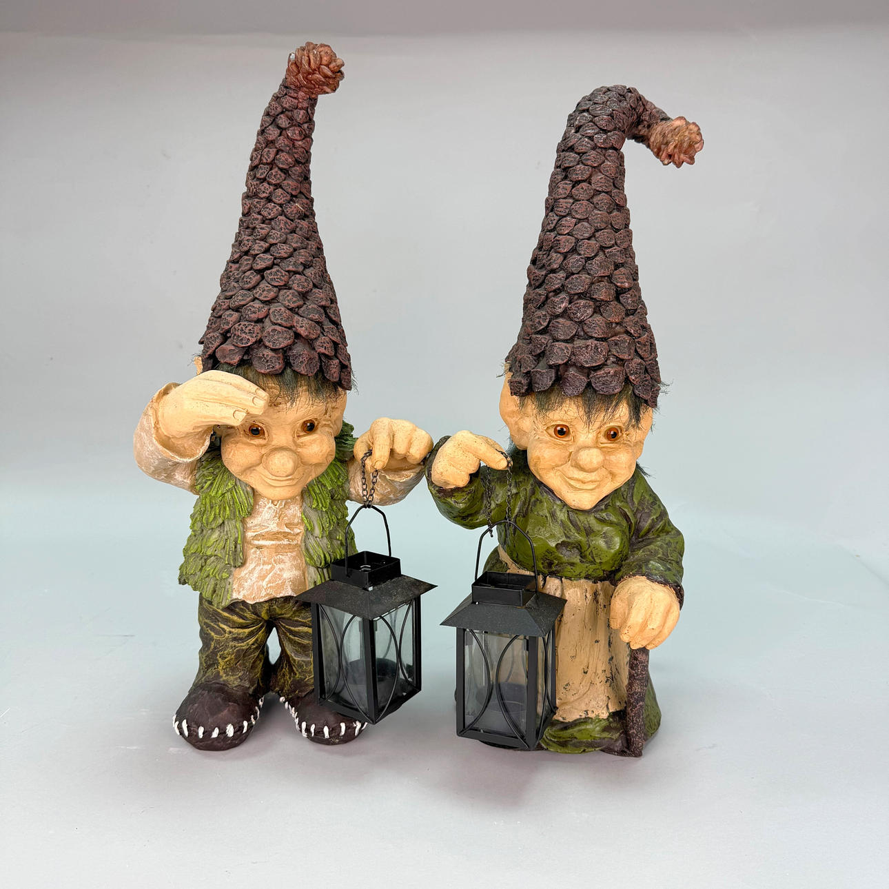 TROLL - Ceramic troll with cone caps and candle lanterns.