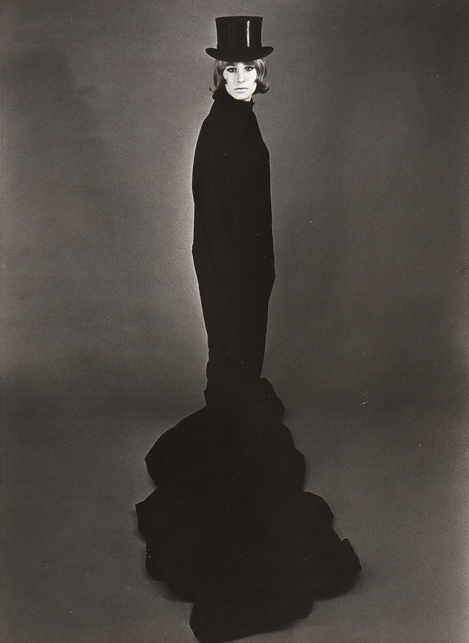 NILS-ERIK WIKEBÄCK. Standing model in hat.