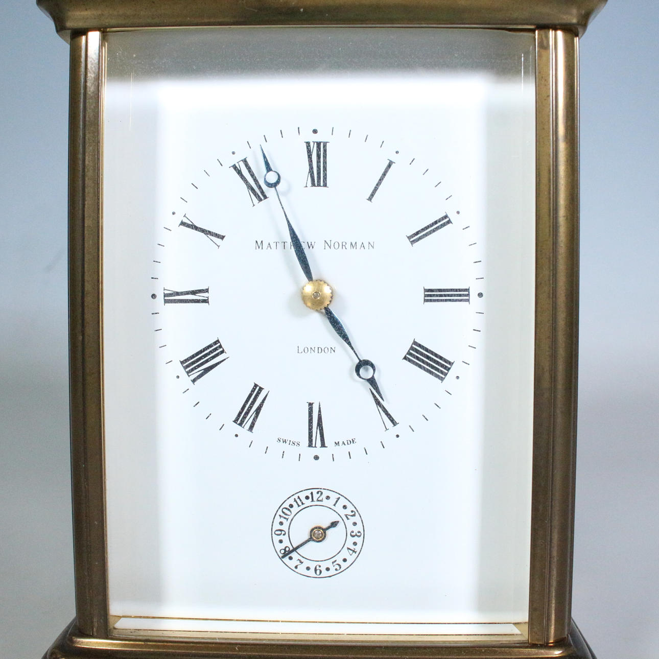 MATTHEW NORMAN. Table clock/travel clock, brass, model 