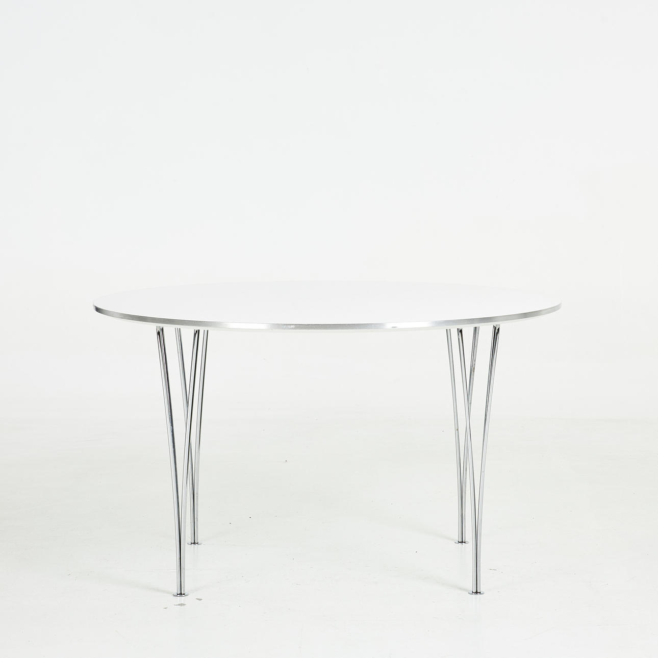BRUNO MATHSSON & PIET HEIN. Dining table, “Superellips “, removable chrome legs, brushed metal edge, for Fritz Hansen, label marked, Denmark 1990.