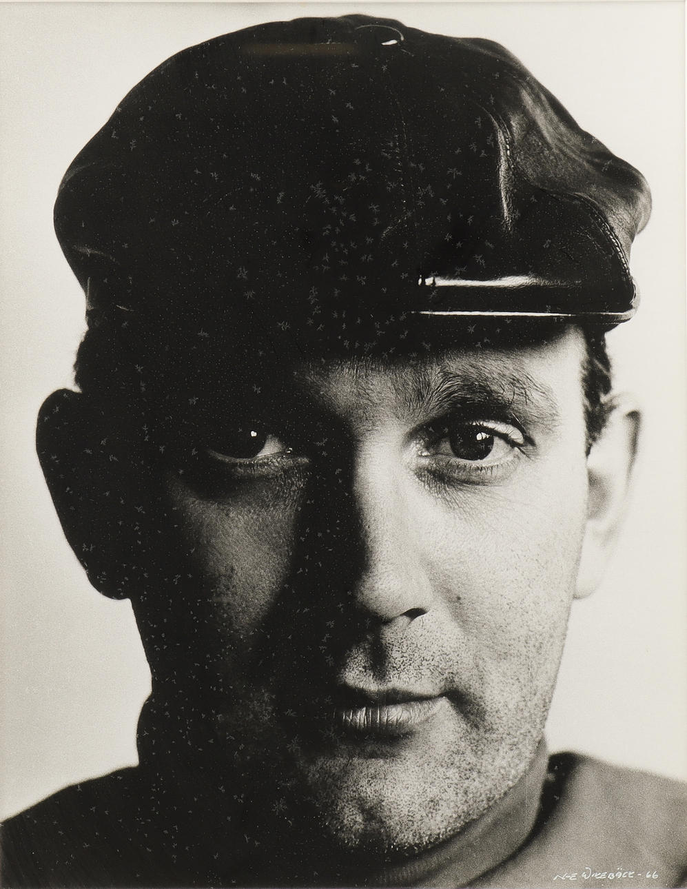 NILS-ERIK WIKEBÄCK. Self-portrait in leather cap.