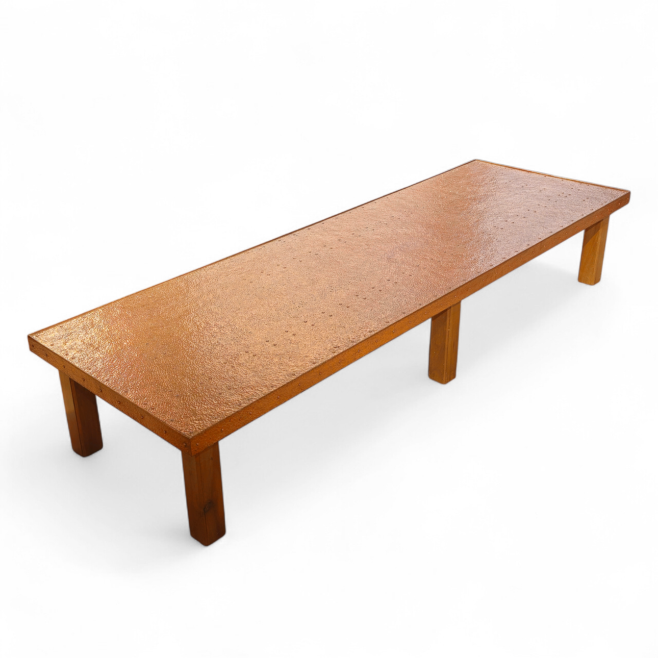 Large and long design table in hammered copper.
