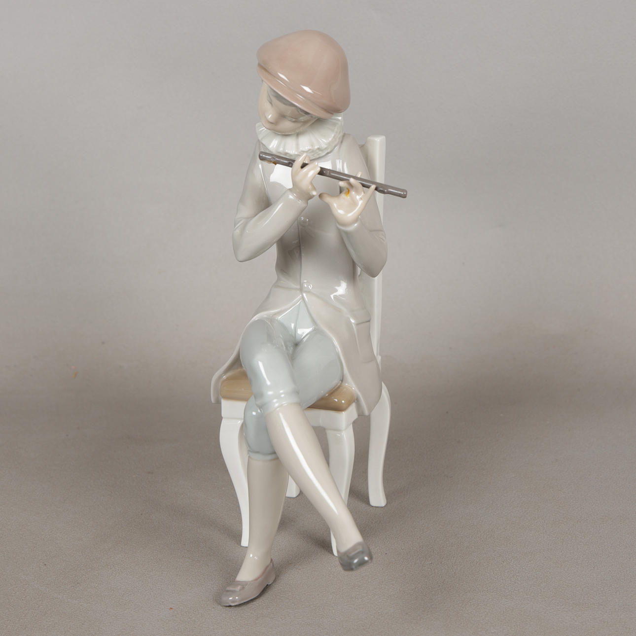 A LLADRO FIGURE "BOY WITH FLUTE" NO 4877.