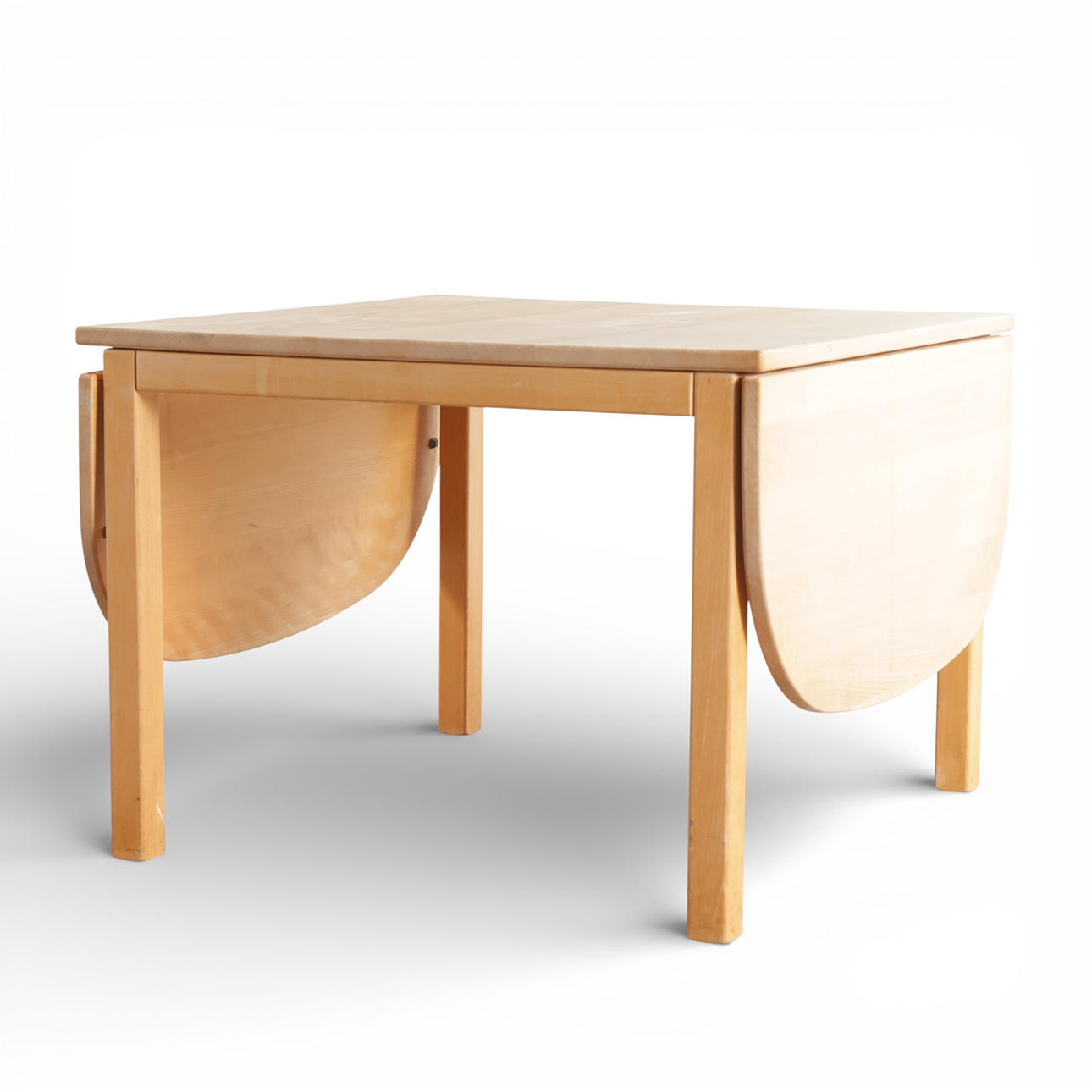 HASLEV MØBELSNEDKERI. Coffee table made of solid beech, square plate with flaps. Manufactured and branded at Haslev Møbelsnedkeri, Denmark.