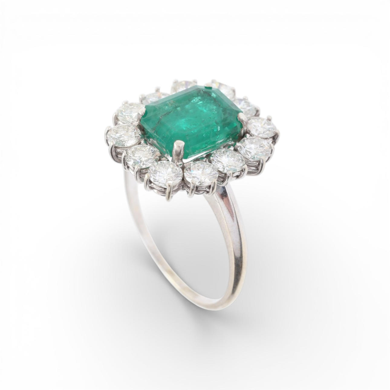 Emerald and diamonds rosette ring.