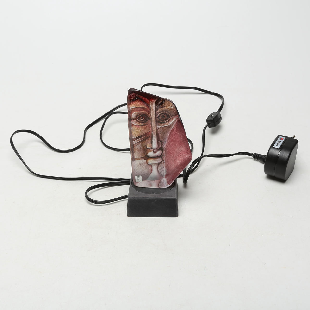 MATS JONASSON. A GLASS SCULPTURE with light box, unsigned.