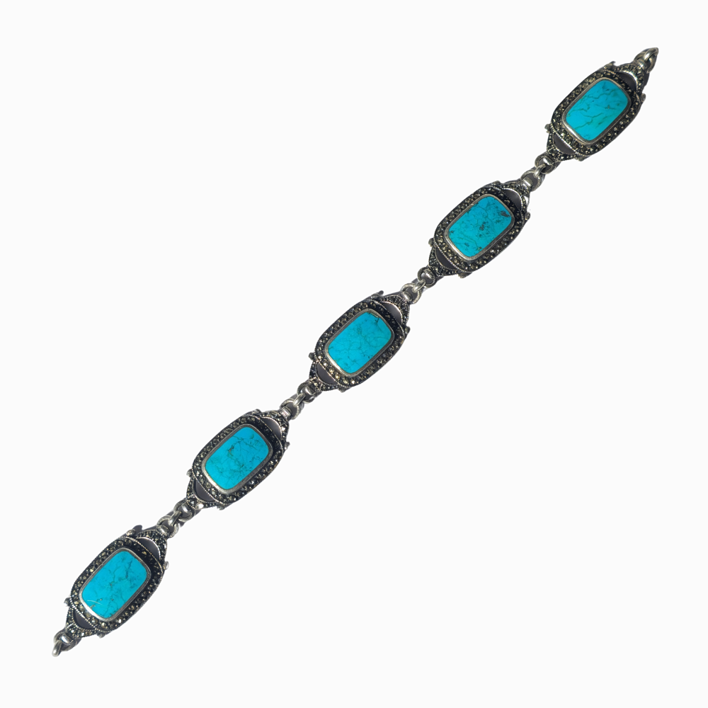 SILVER BRACELET WITH MARQUESITAS AND TURQUOISE.