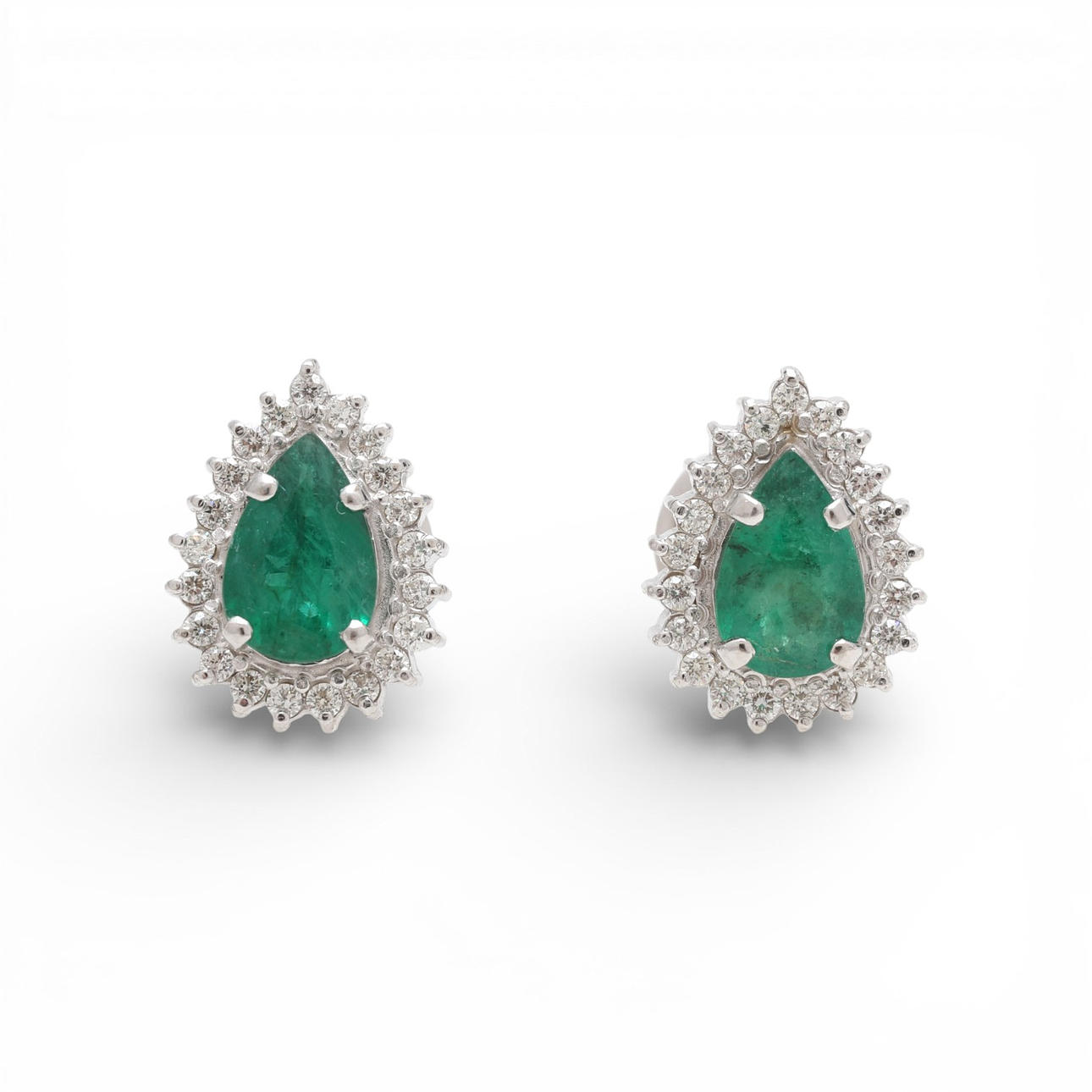 Emeralds and diamonds rosette earrings.
