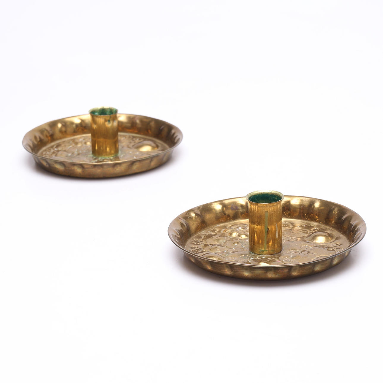 A pair of baroque brass candlesticks.