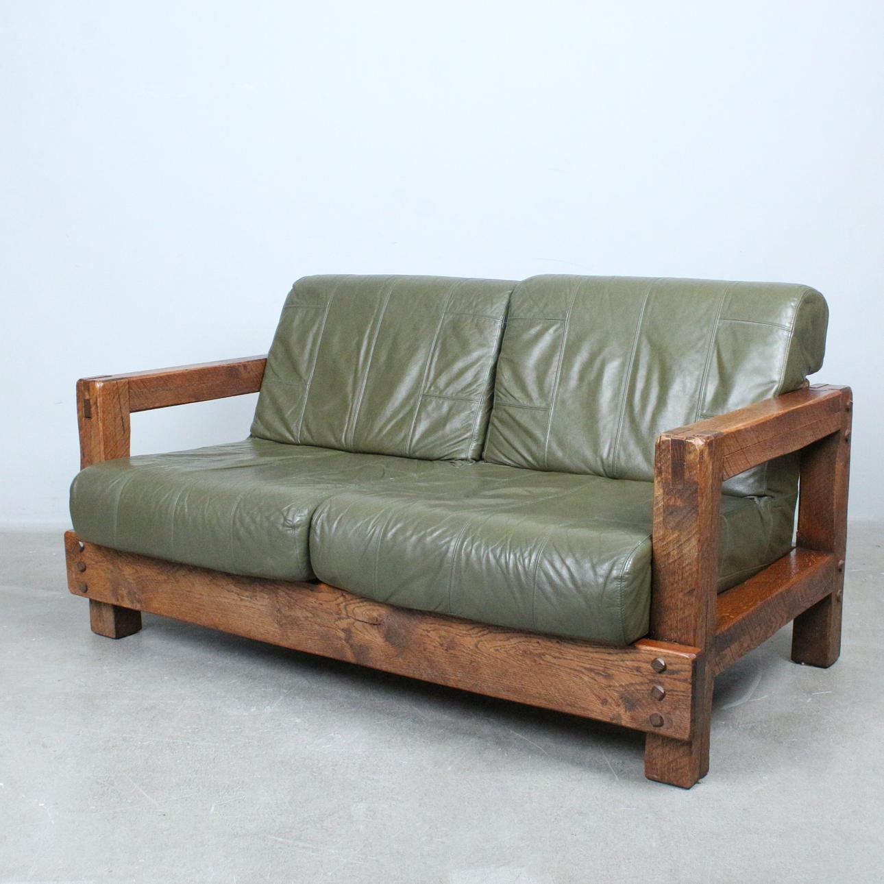 1970s brutalist two-seater sofa, leather, oak.