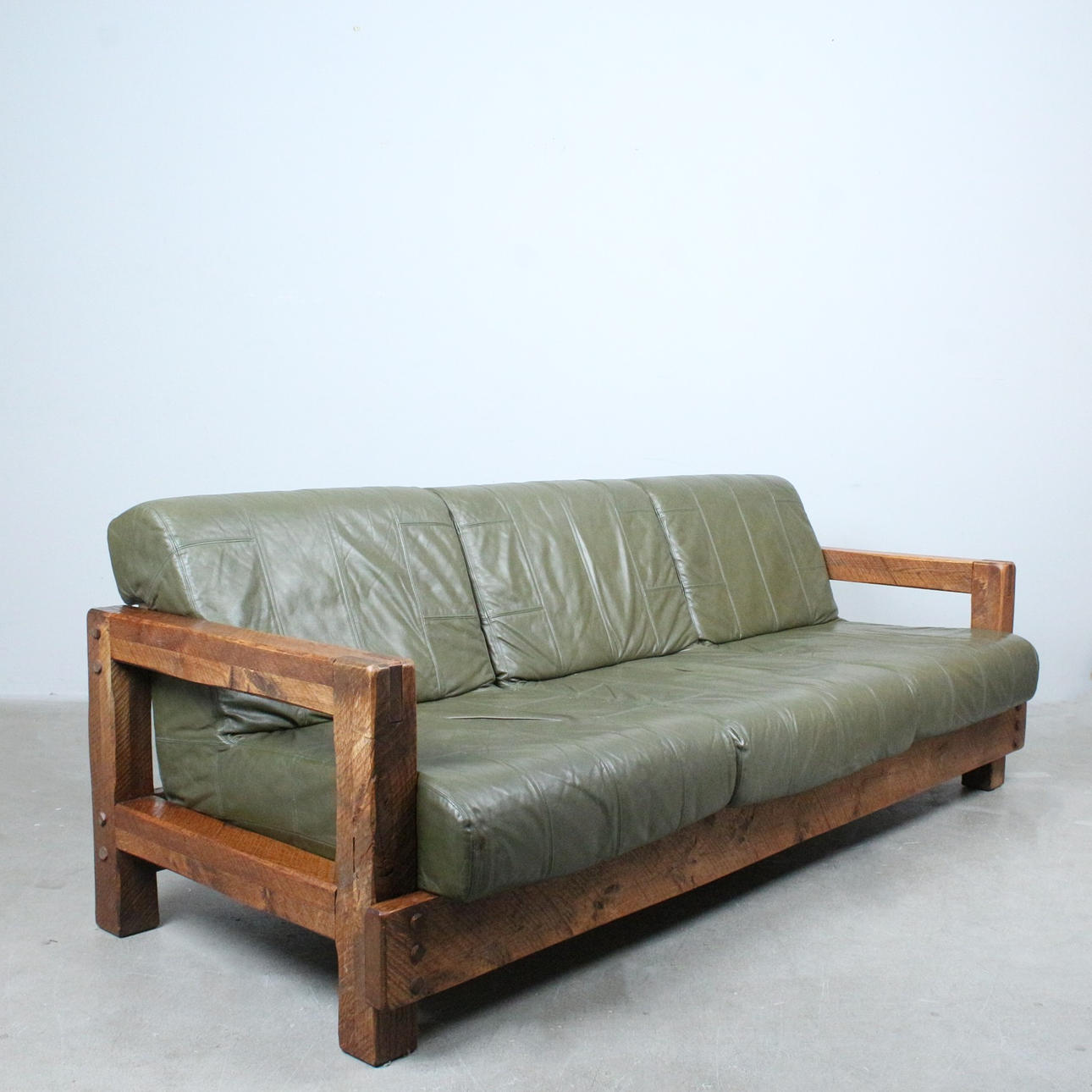 1970s brutalist three-seater sofa, leather, oak.