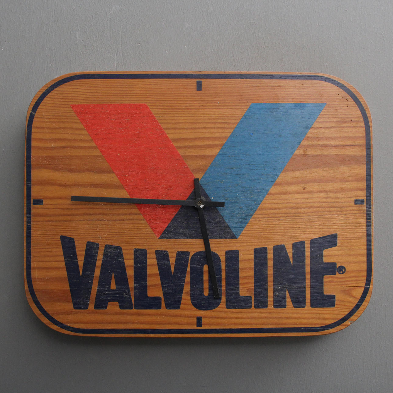 Wall clock, wood, Valvoline.