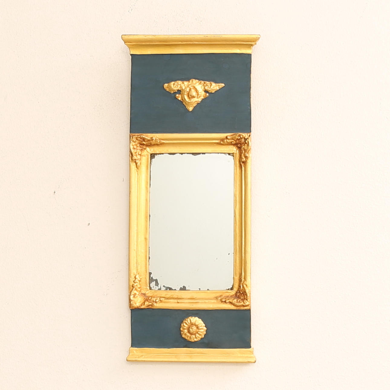 A 20th century Empire style mirror.