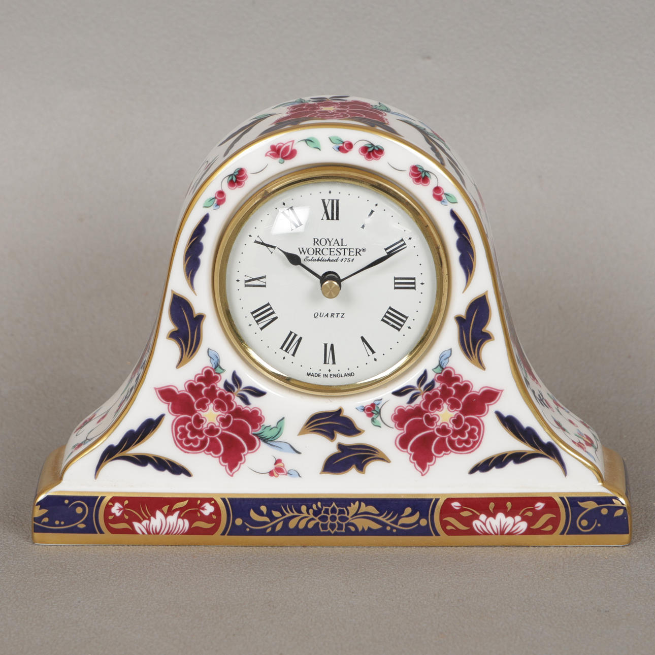 A ROYAL WORCESTER "PRINCE REGENT" PATTERN MANTLE CLOCK.