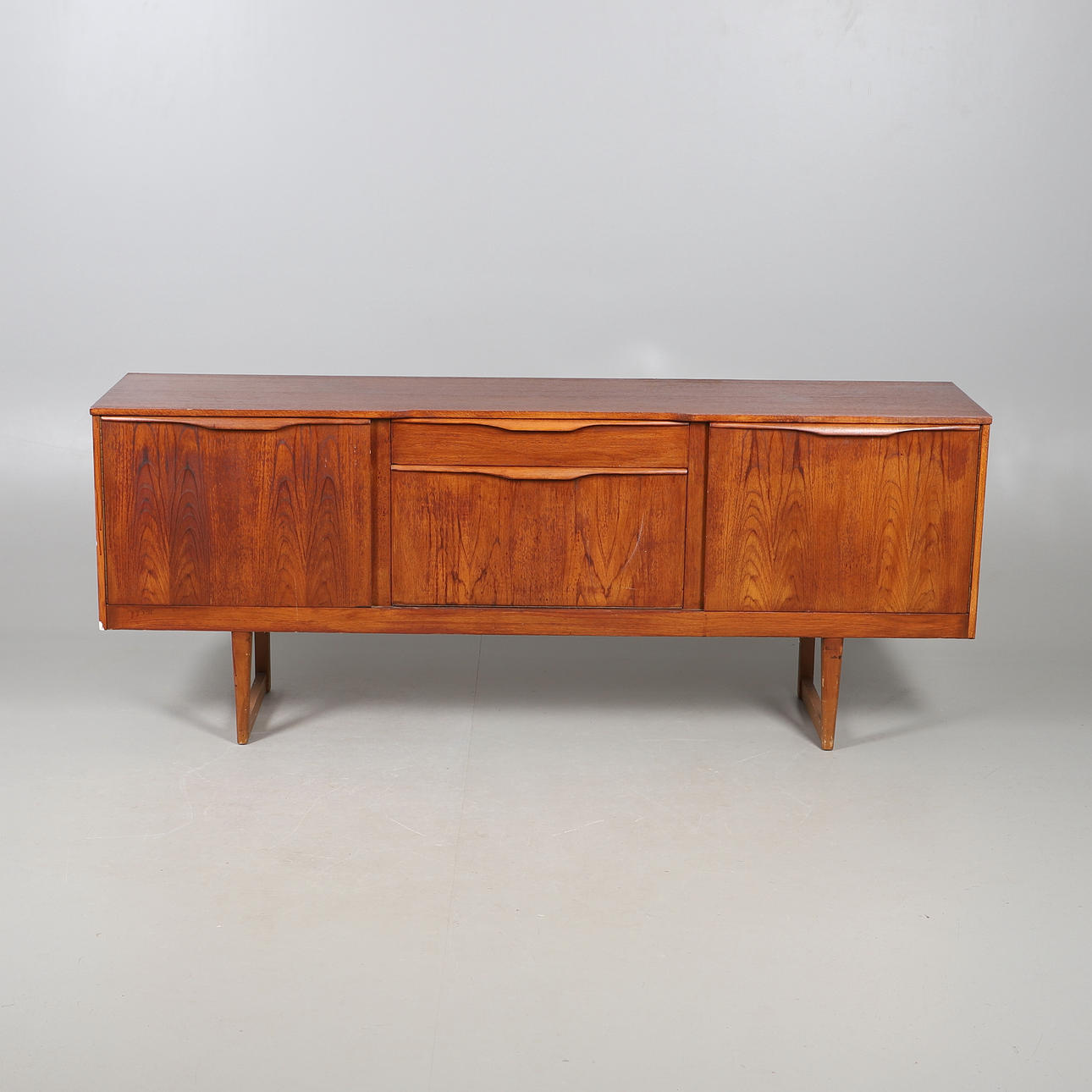 MID CENTURY TEAK SIDEBOARD.