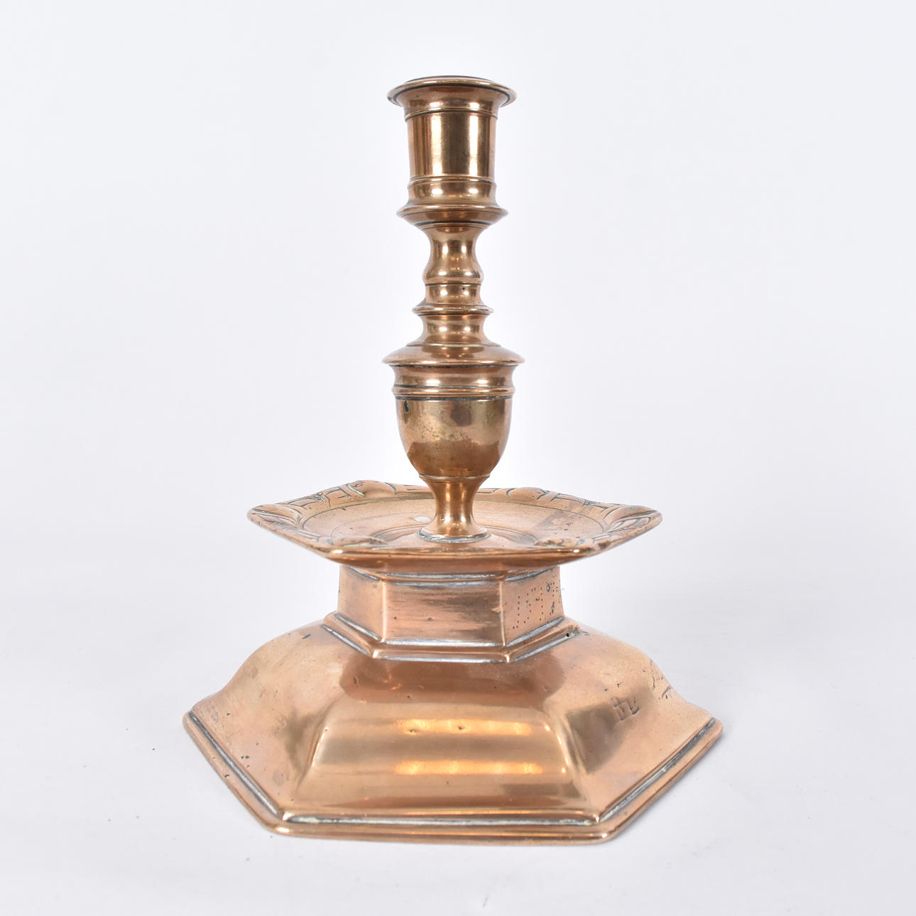 A Renaissance brass candlestick, probably Nuremberg, engraved monogram and dated 1547.